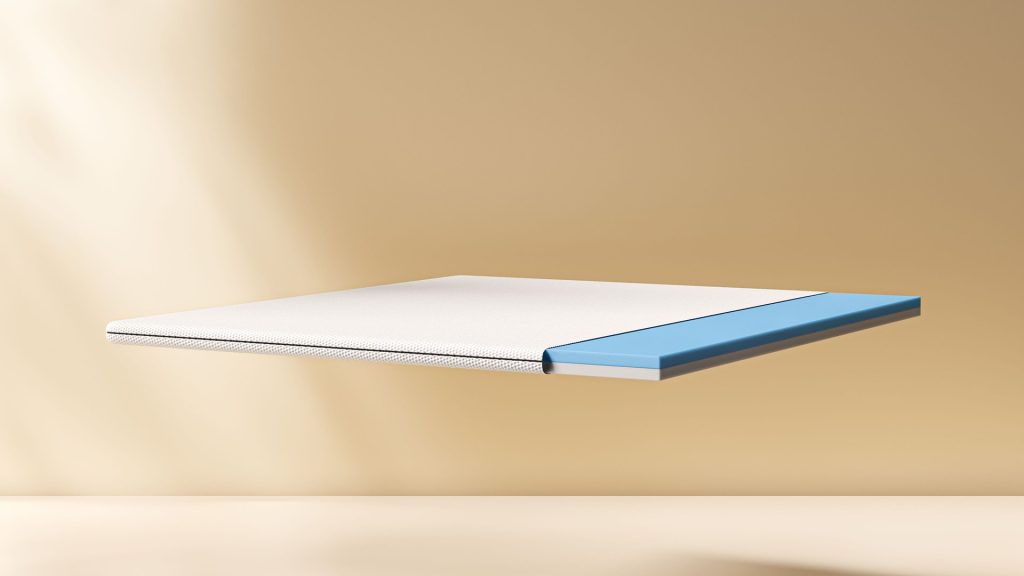 Emma Original Topper seen from the side, showing the blue foam edge