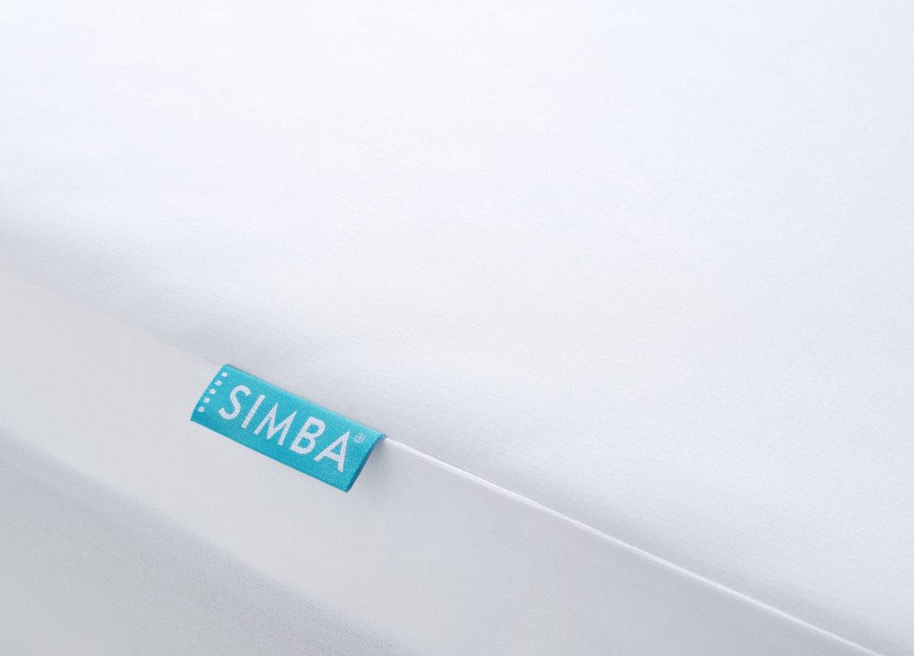 Simba TripleShield Bamboo Mattress Protector, close-up of the smooth bamboo jersey top and label