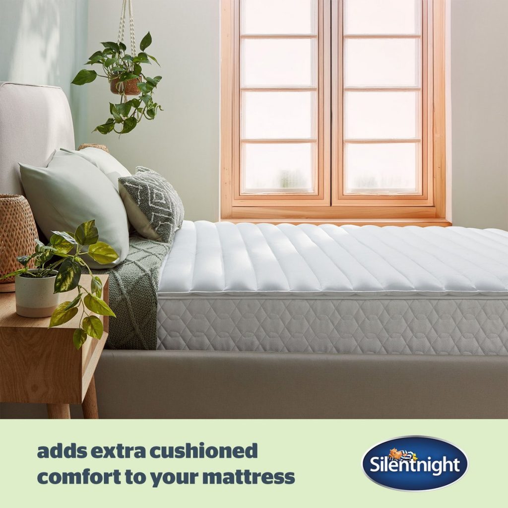 Silentnight Anti-Allergy topper on a bed by a window