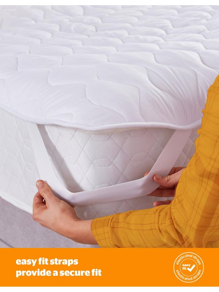 Hands fitting the easy-fit strap of the Silentnight heated mattress topper