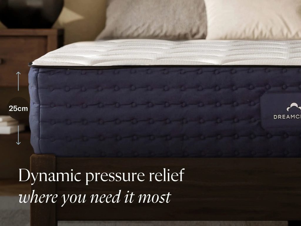 Side of the DreamCloud Hybrid mattress with its 25 cm depth marked