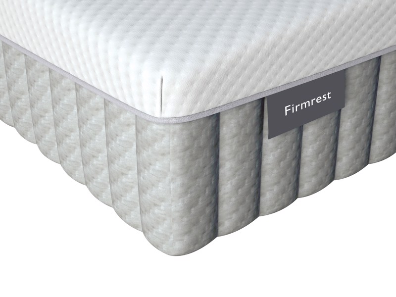 Corner of the Dunlopillo Firmrest mattress with quilted border and model label