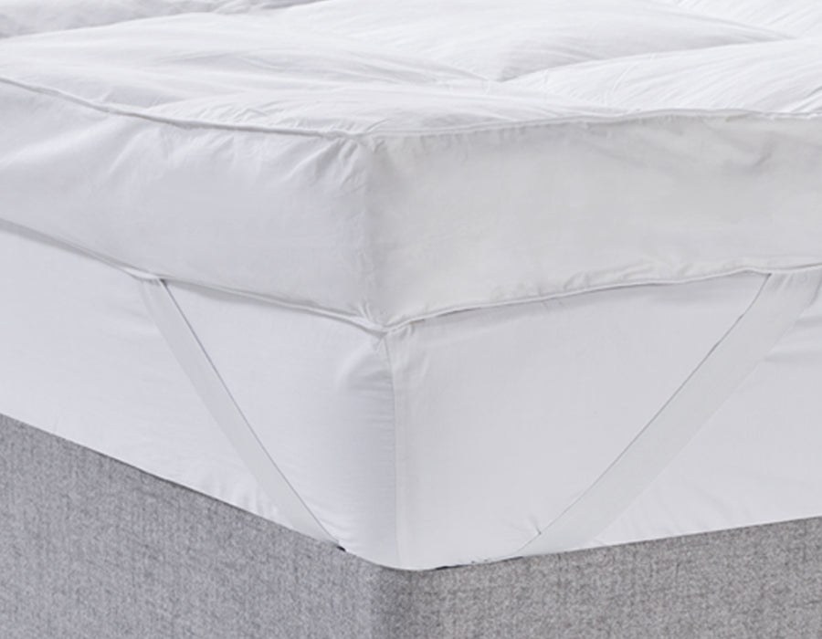 Deep side panel and elastic corner strap of the Early's 5in feather topper