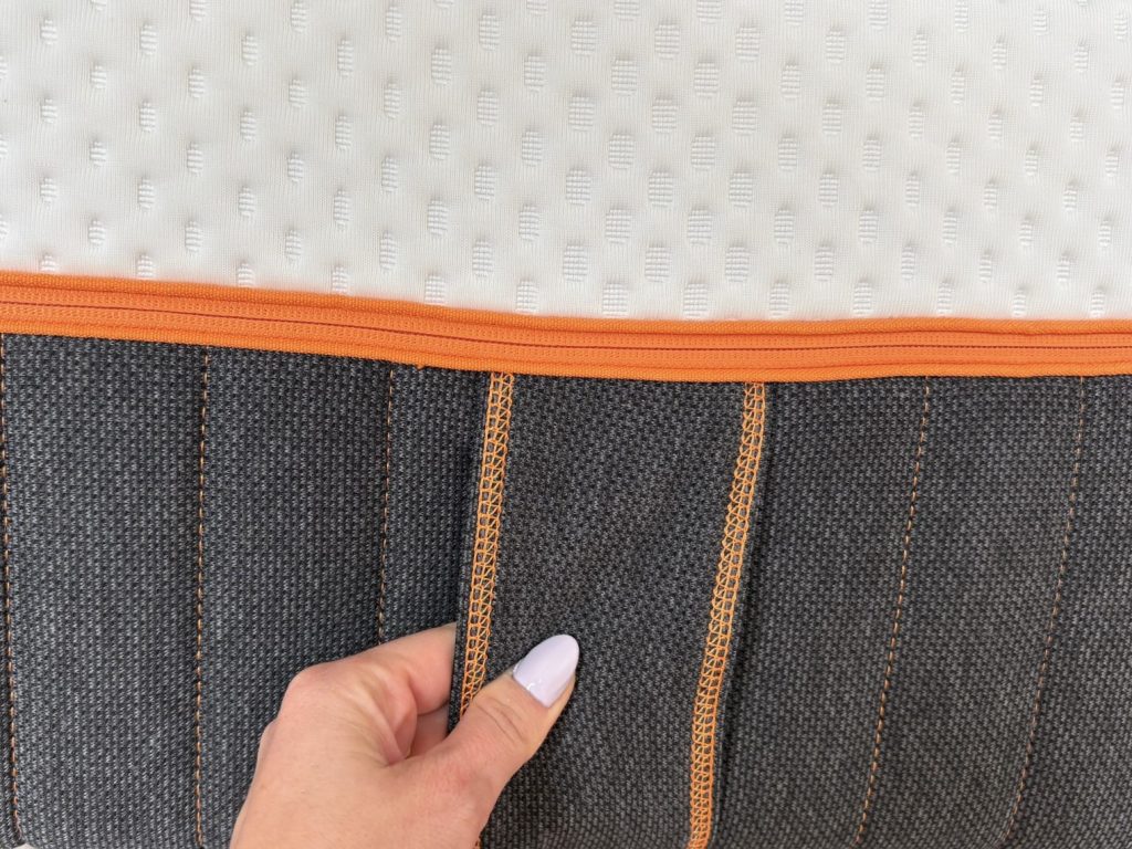 Side fabric of the Emma Performance with orange stitching