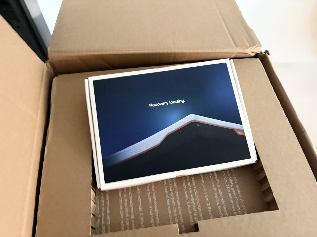 The Emma Performance delivery box opened, with the presentation box inside
