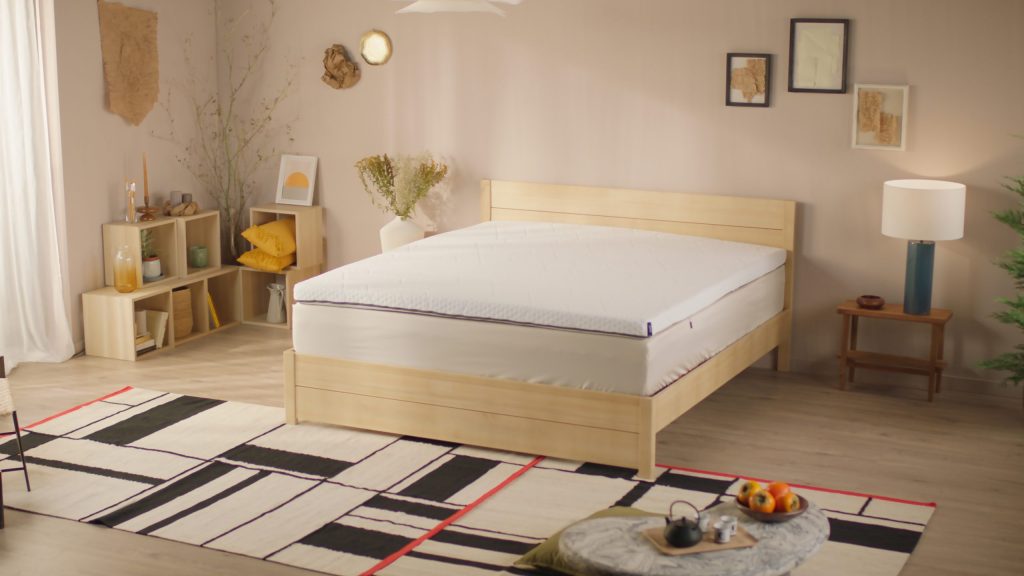 Emma Original Pro Topper on a bed in a bright bedroom