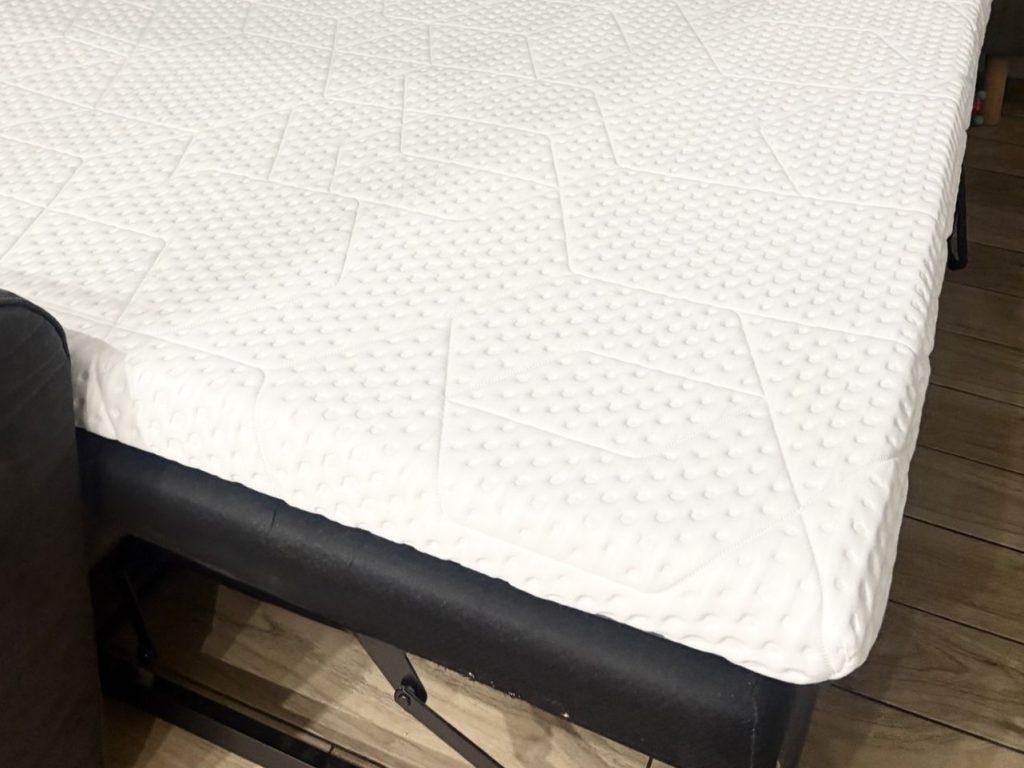 Corner of the Emma Original Pro Topper on the sofa bed