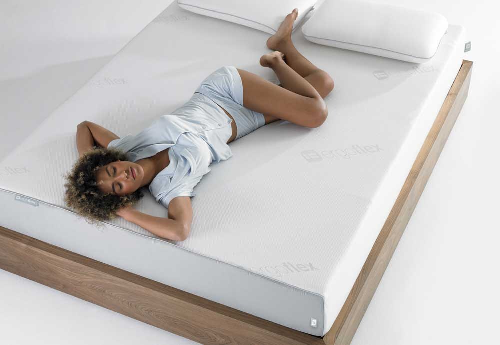 Woman relaxing on the Ergoflex 5G mattress