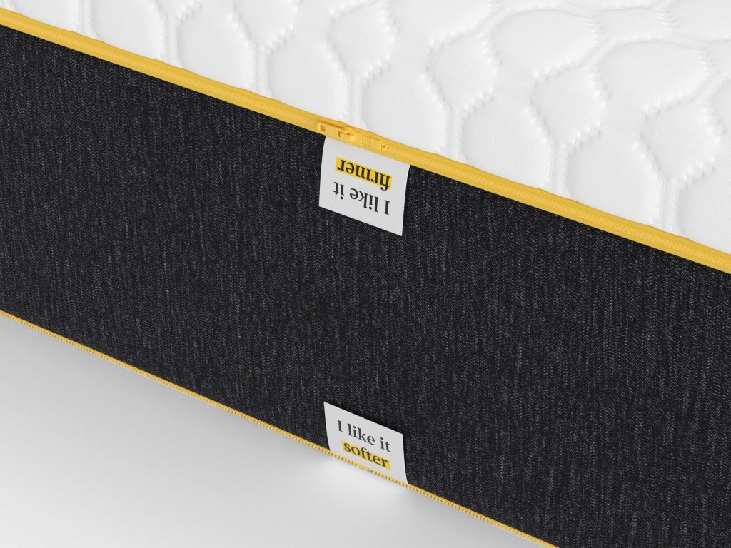 Stitched firmer and softer side labels on the Eve Wunderflip Premium Hybrid Mattress