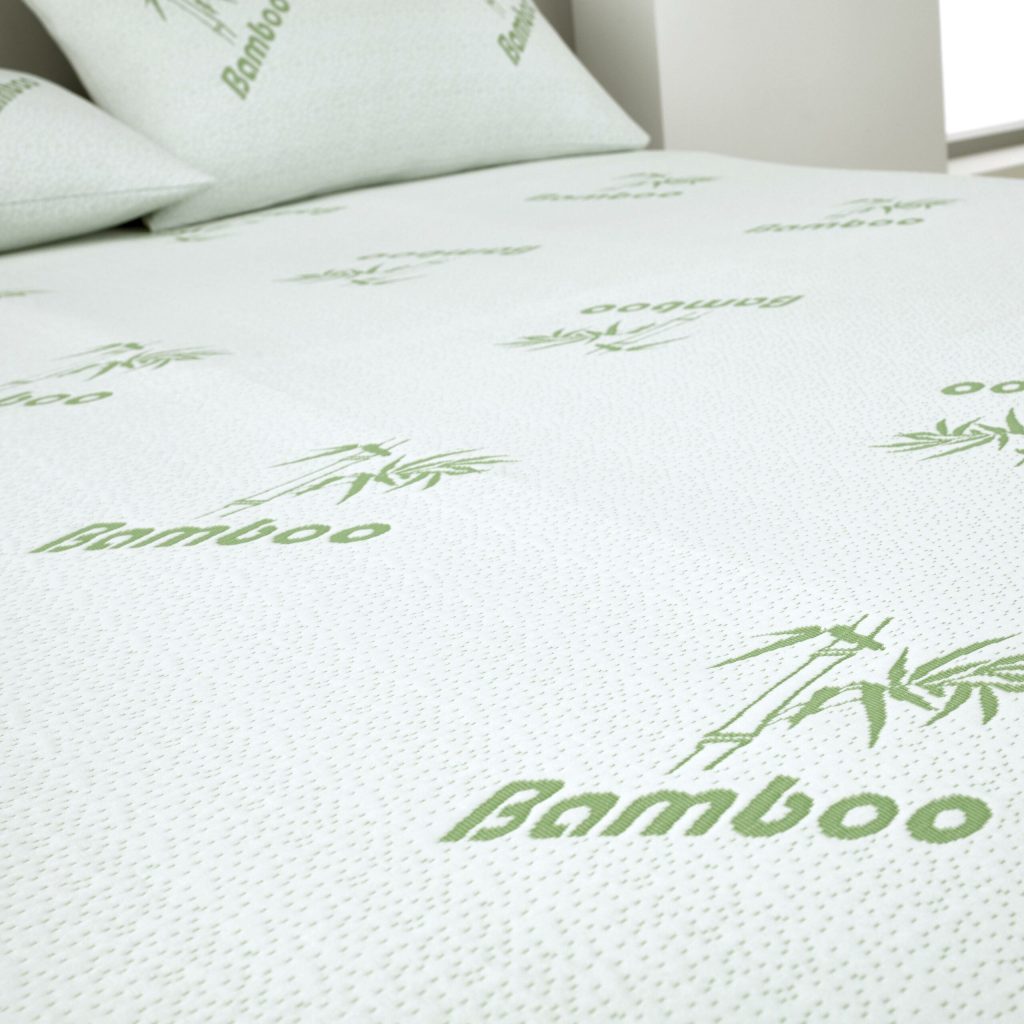 Bamboo-print cover of the GC 2cm topper next to matching pillows