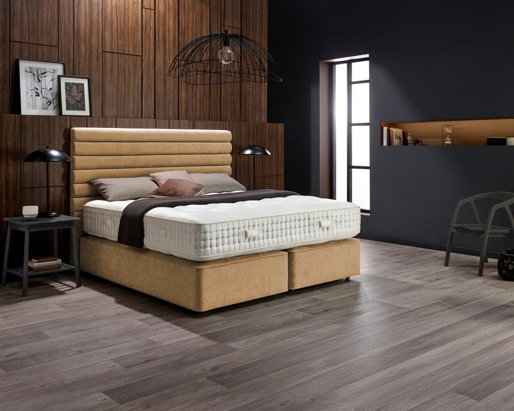 Harrison Spinks Caspian 13750 mattress on a tan divan in a dark panelled bedroom