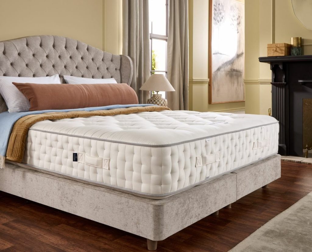 Harrison Spinks Diamond 25000 mattress on a beige divan with a buttoned headboard