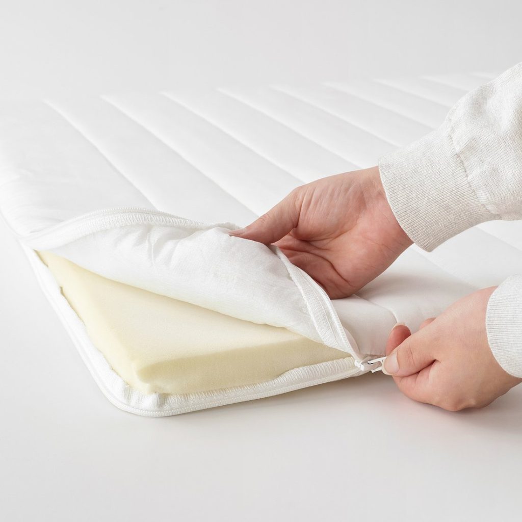 IKEA Näsfjället mattress pad with the cover unzipped to show the foam