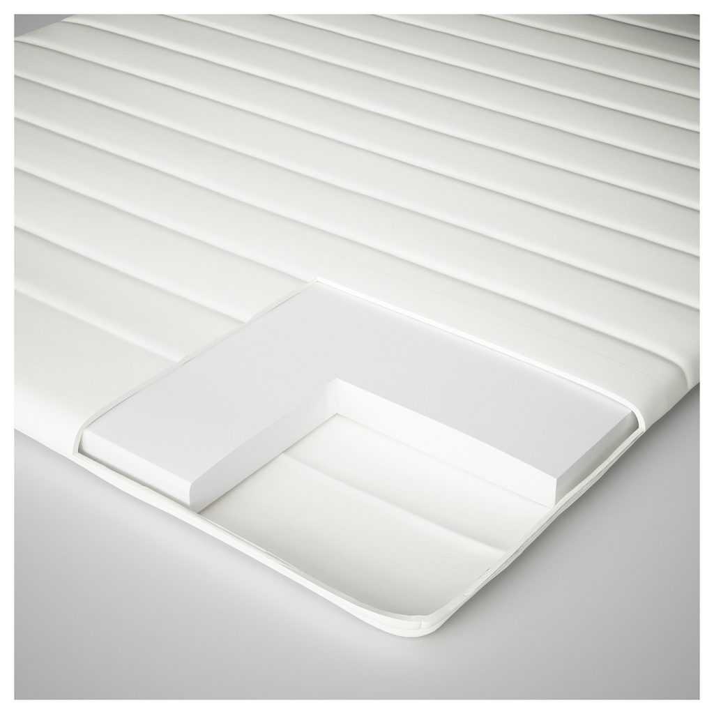 IKEA Näsfjället mattress pad cutaway showing the white foam core under the quilted cover