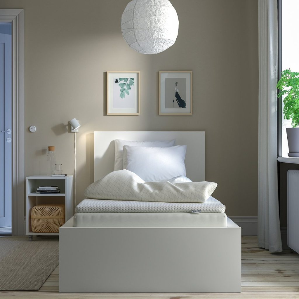 IKEA Nisseholm mattress pad on a single bed in a bedroom
