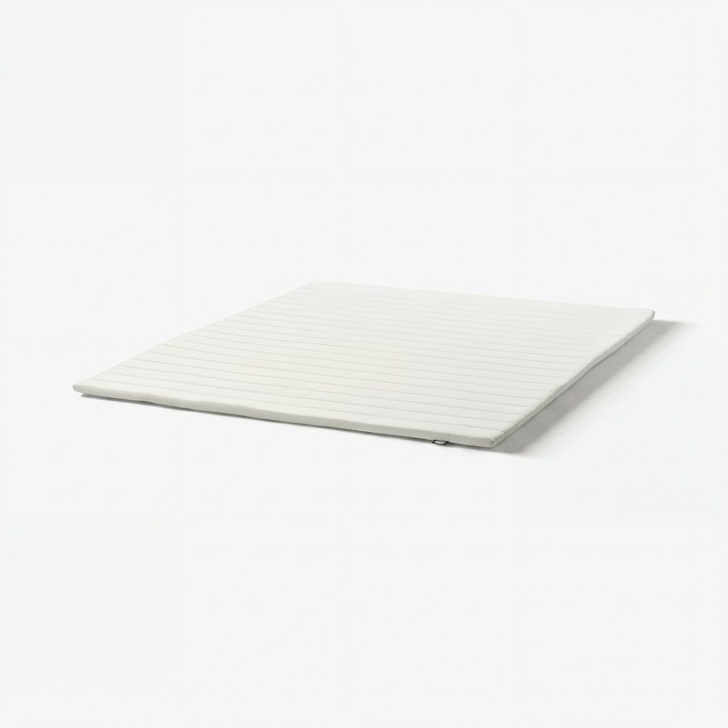 IKEA Nopakte foam mattress pad, product photo on a white background