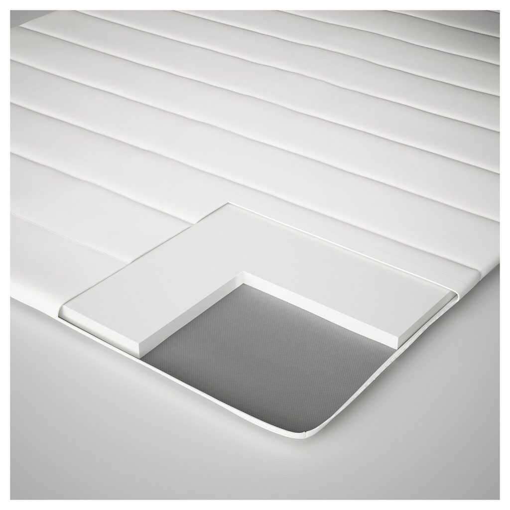 IKEA Nopakte mattress pad cutaway showing the thin foam core under the cover