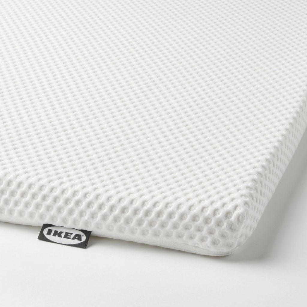IKEA Nordberget mattress pad, close-up of the textured cover and IKEA label