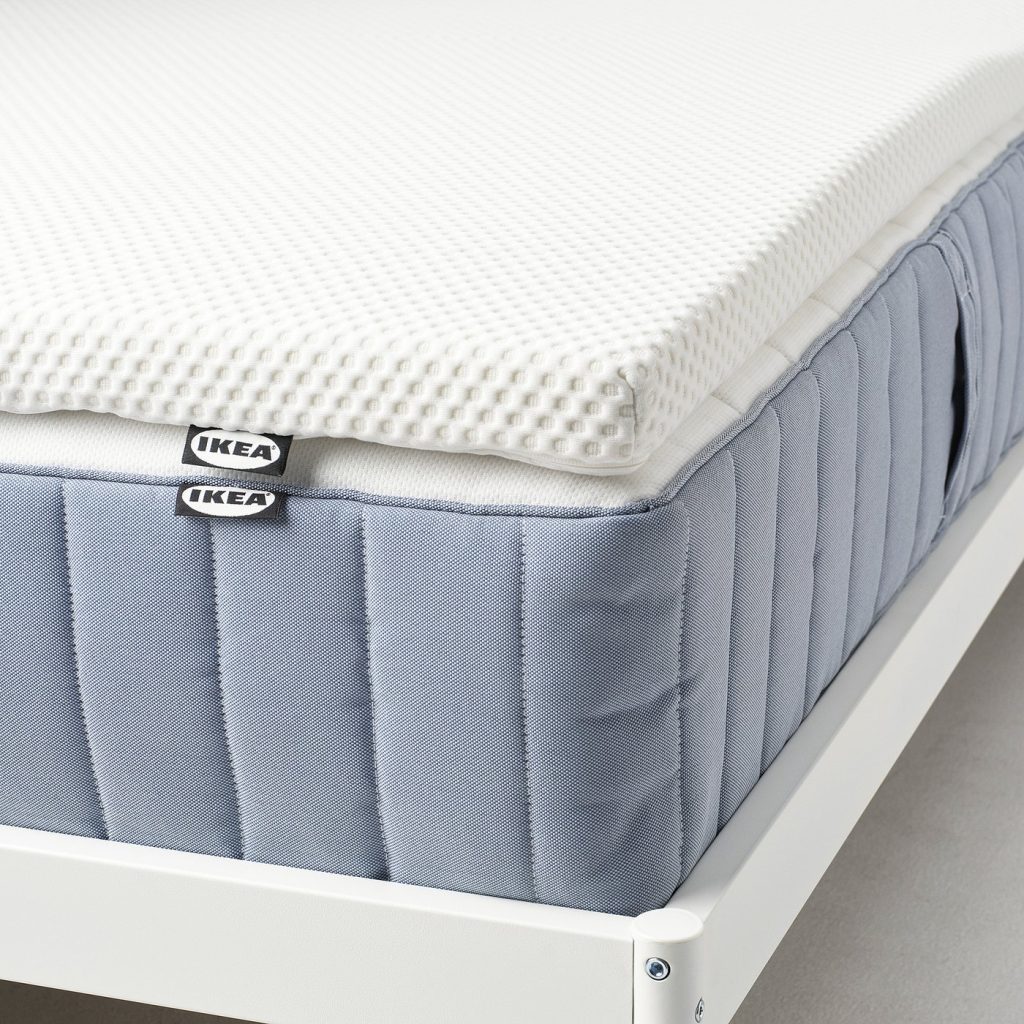 IKEA Nordberget mattress pad on a sprung mattress, side view of the 4.5 cm memory foam layer