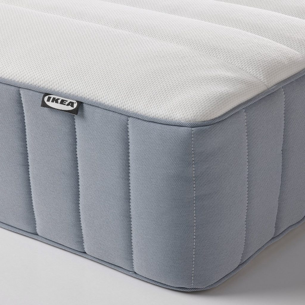 IKEA Valevåg mattress close-up of the quilted top, grey side panel and IKEA label