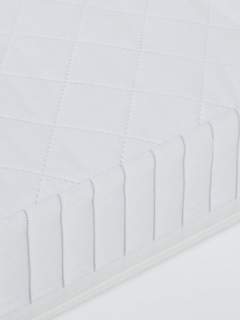 John Lewis Pocket Spring Cotbed Mattress close-up of the quilted topper and side panel