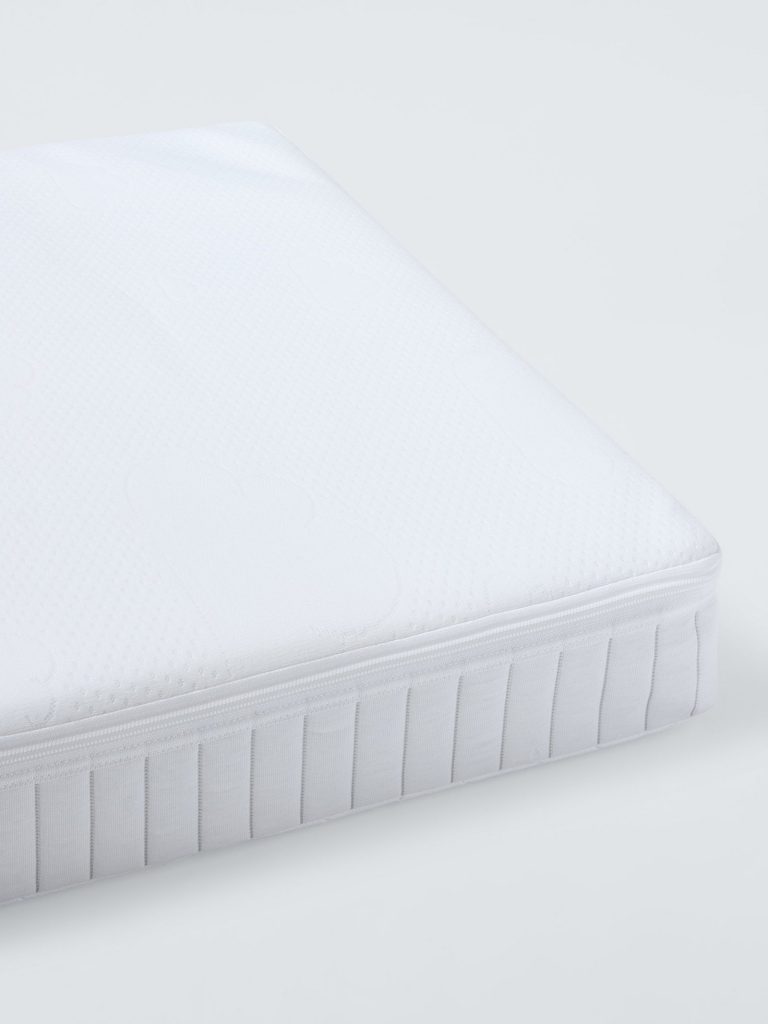 John Lewis Pocket Spring Cot Mattress corner showing the zipped topper