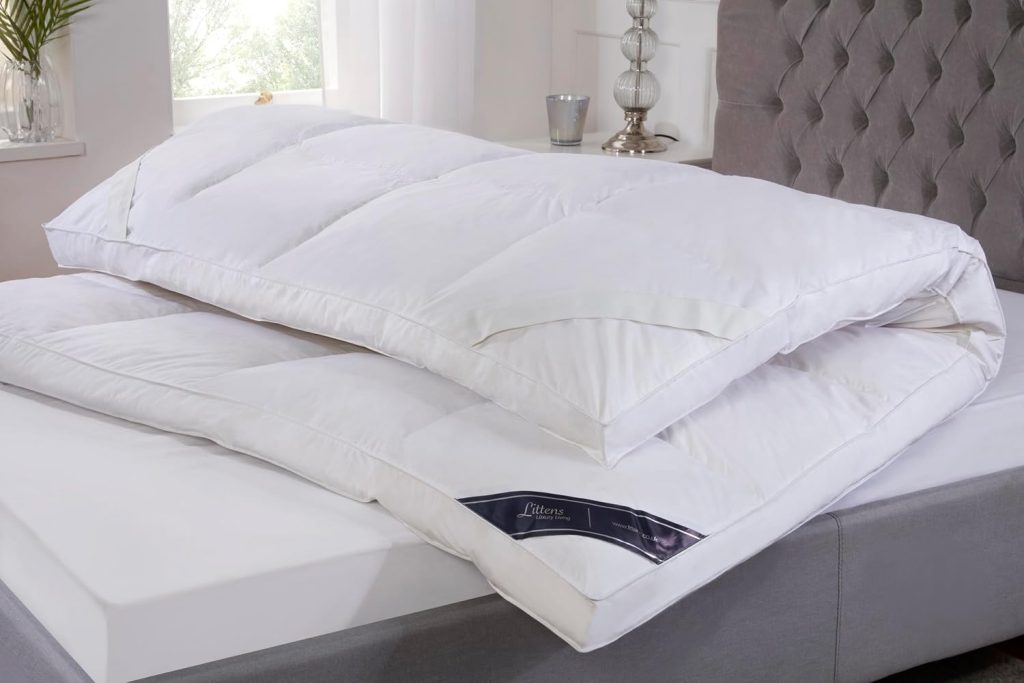 Littens Goose Feather and Down Mattress Topper folded back on a mattress