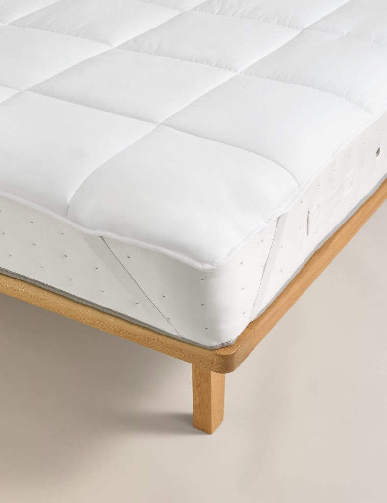 M&S Luxury Down Alternative Mattress Topper fitted on a mattress