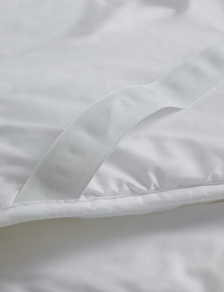 Elasticated strap on the M&S Luxury Down Alternative Mattress Topper