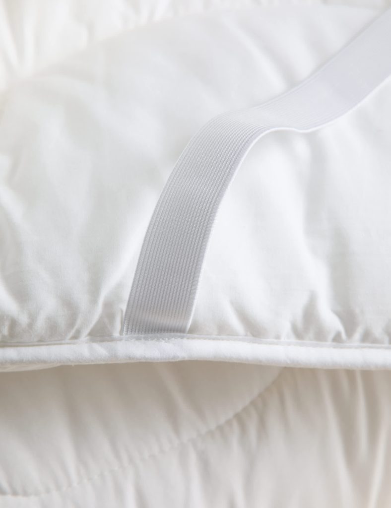 Elasticated corner fastening on the M&S Stay Cool Pure Cotton Mattress Topper