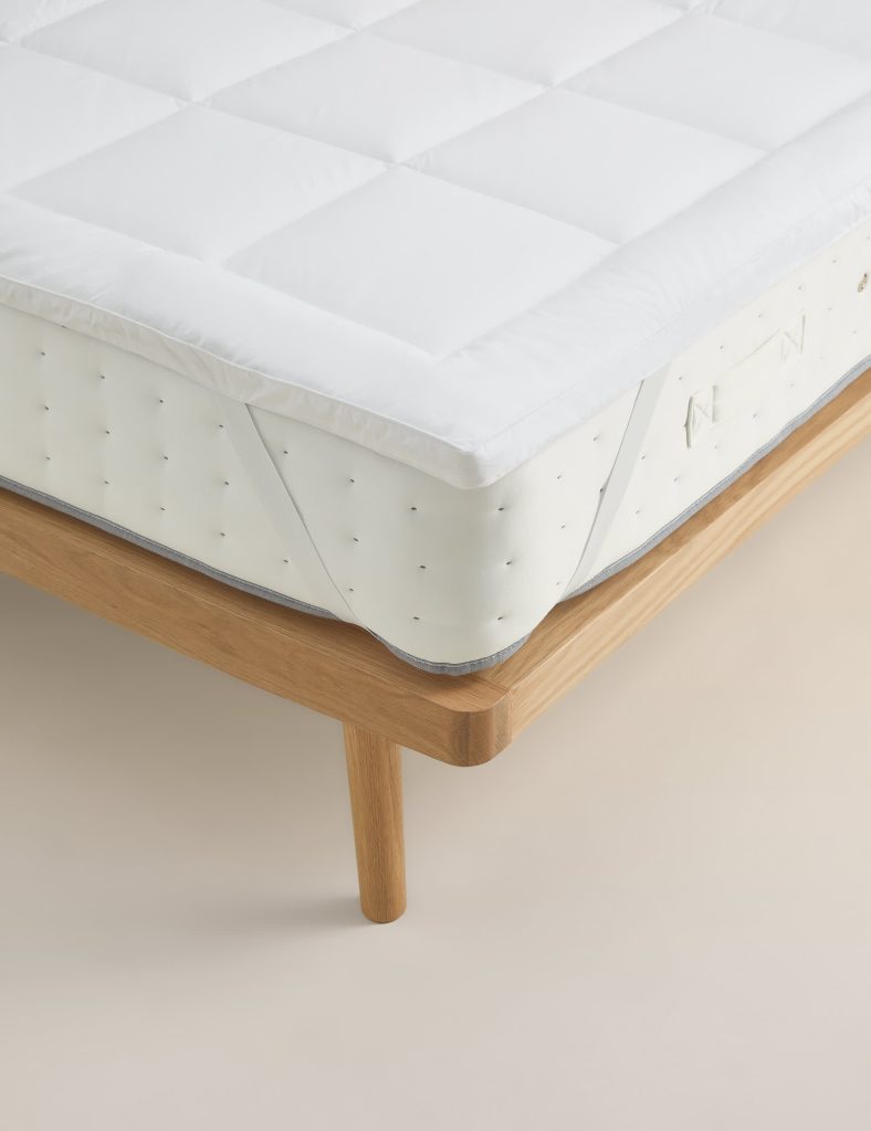 M&S Ultimate Comfort Mattress Topper with square quilting fitted on a mattress