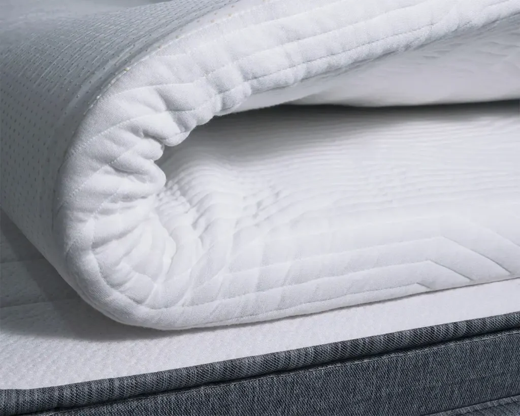 Origin Contour Mattress Topper partly rolled up