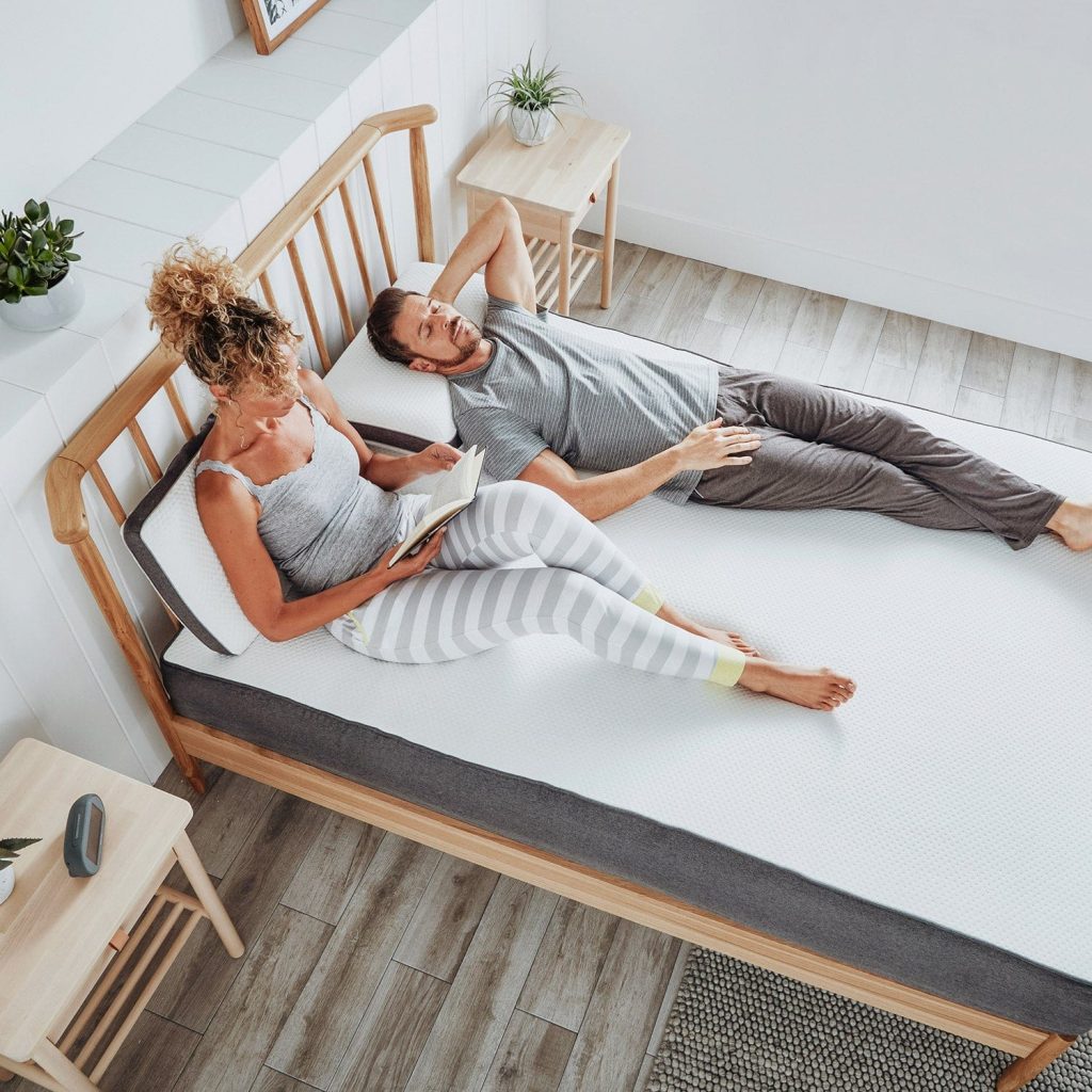 Couple relaxing on the OTTY Original Hybrid Mattress, overhead view