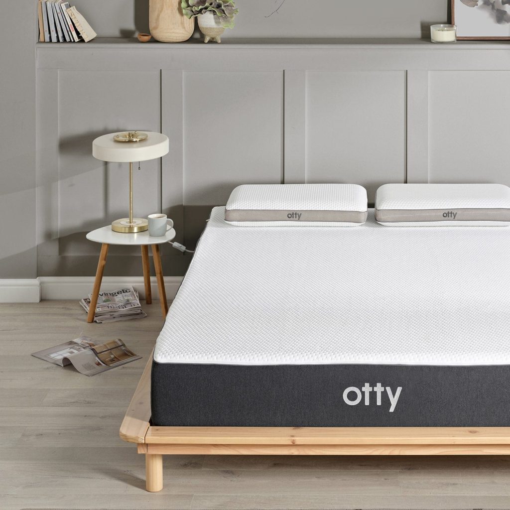 OTTY Original Hybrid Mattress on a wooden bed frame with two OTTY pillows, front view