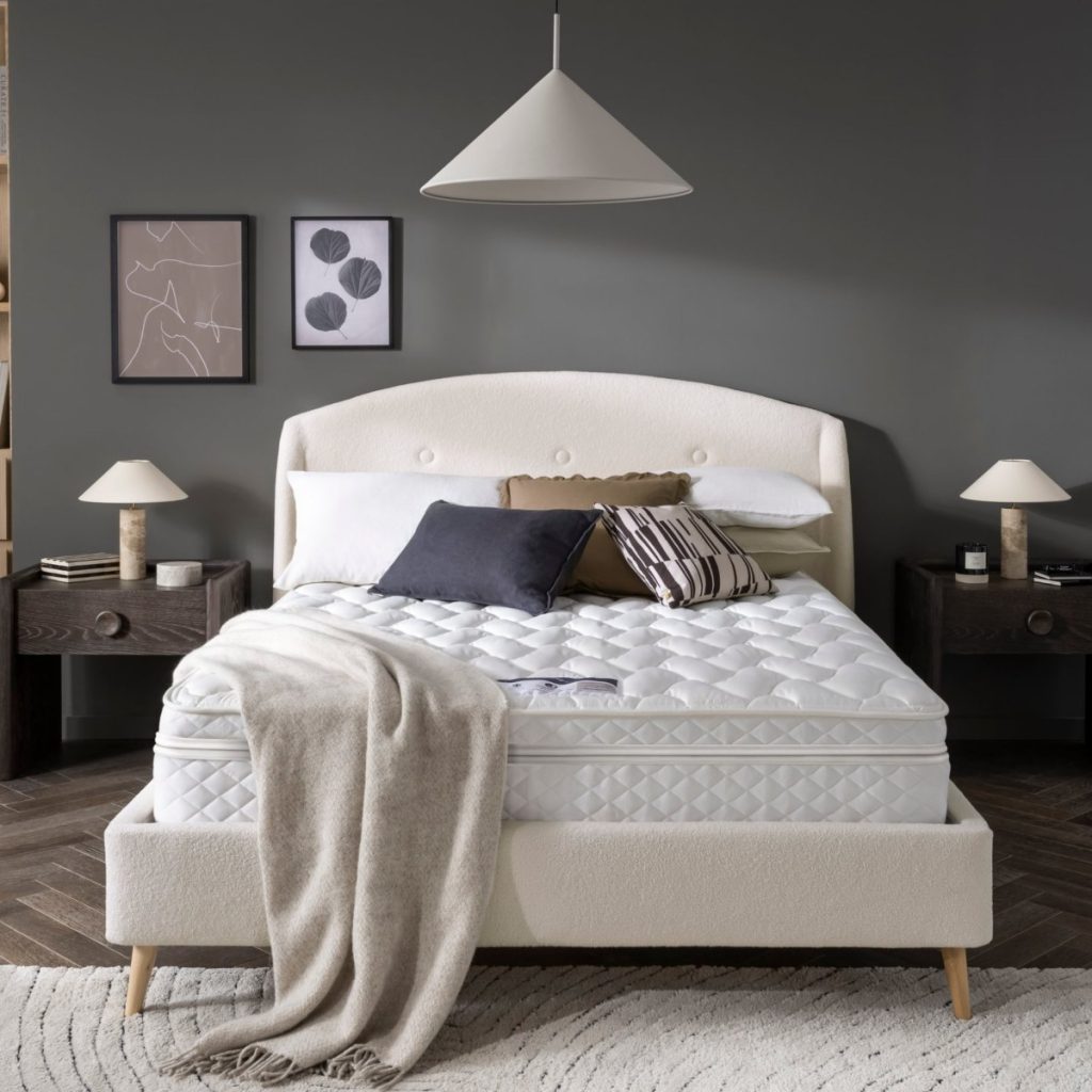 Premier Inn Mattress 2.0 on a cream upholstered bed in a grey bedroom