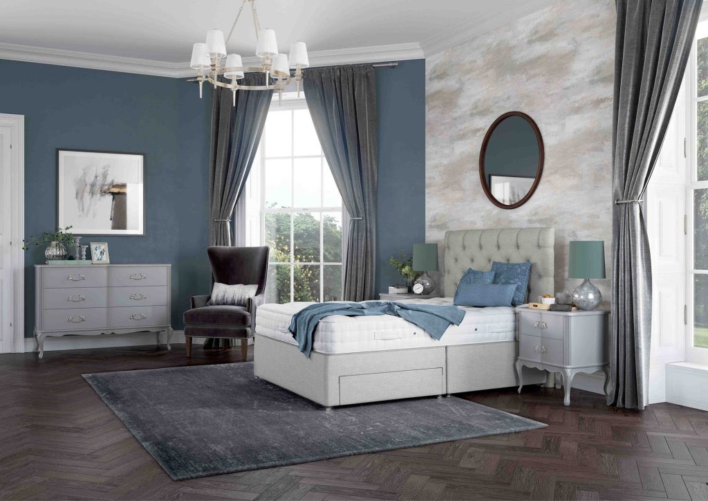 Relyon Braemar mattress on a grey divan in a blue-walled bedroom