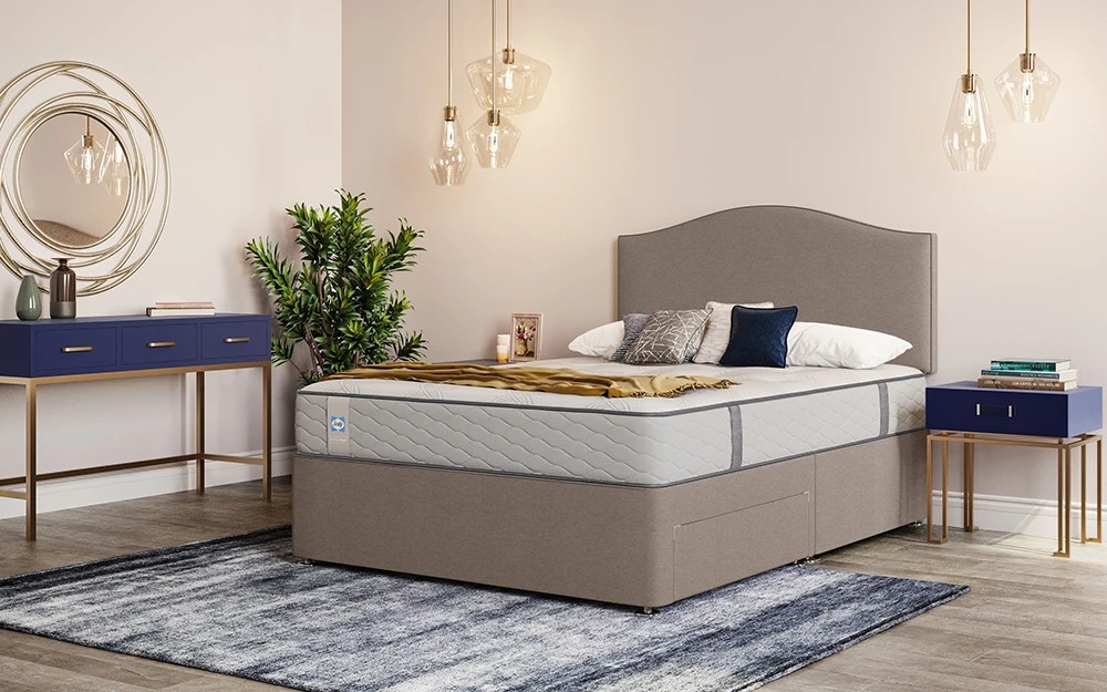 Sealy Mellbreak Ortho Plus mattress on a taupe divan with drawers, angled view