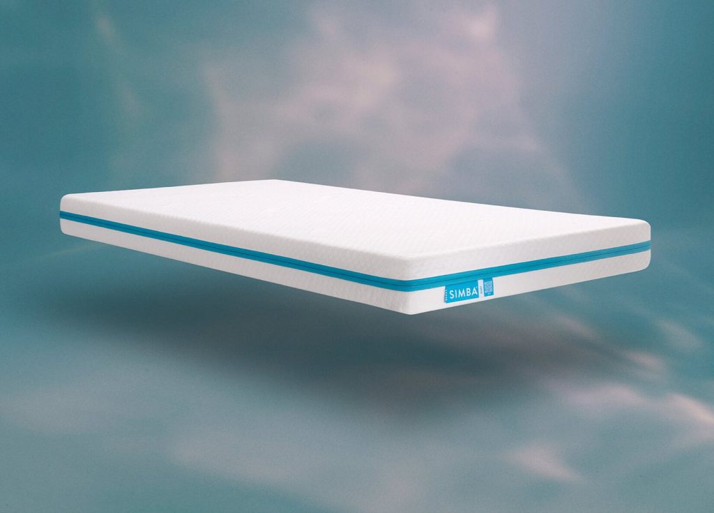 Simba Hybrid Cot Bed Mattress floating against a sky backdrop