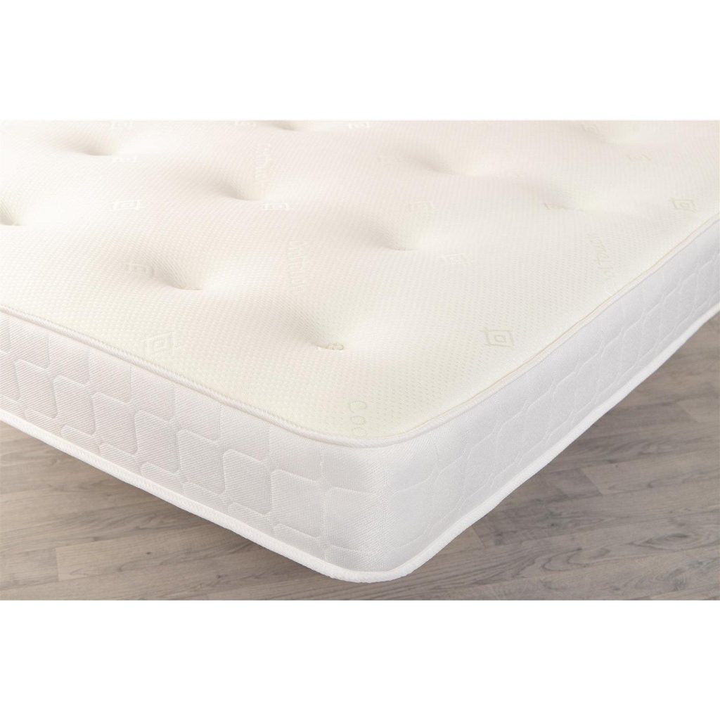 Corner of the Starlight Beds Virgo mattress showing the tufted top and box tile border
