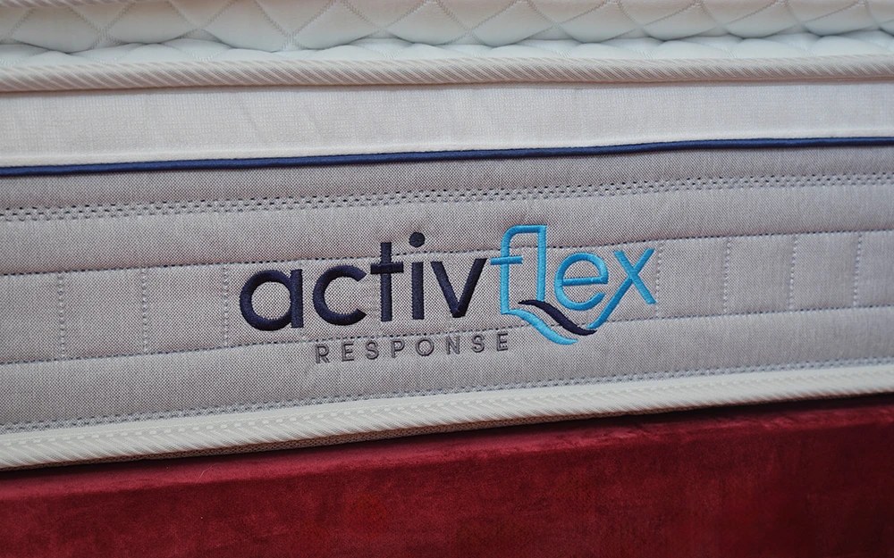 ActivFlex Response logo embroidered on the side of the Sleepeezee mattress