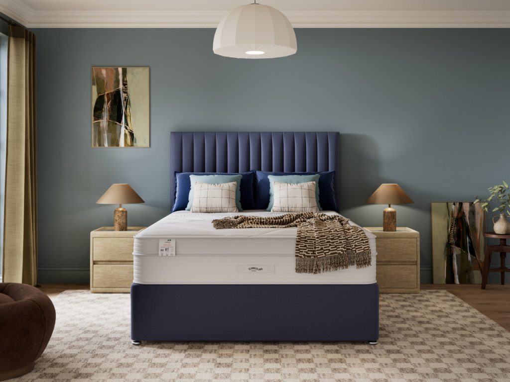 Slumberland Air 6.0 Memory mattress on a navy divan with a blue panelled headboard