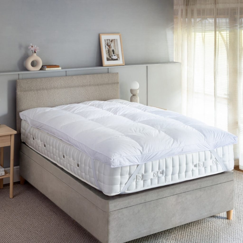 Soak&Sleep Goose Down Dual Chamber topper on a bed