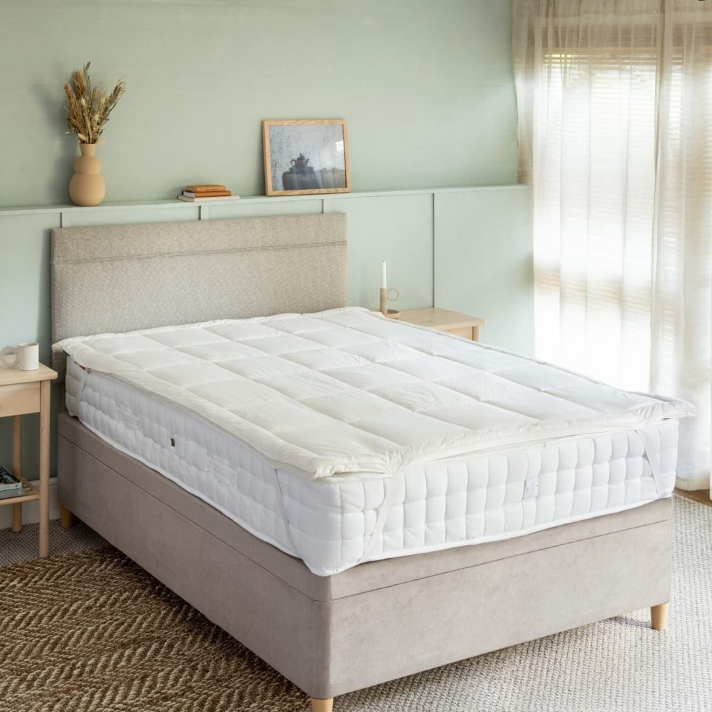 Soak&Sleep New Zealand wool topper on a bed
