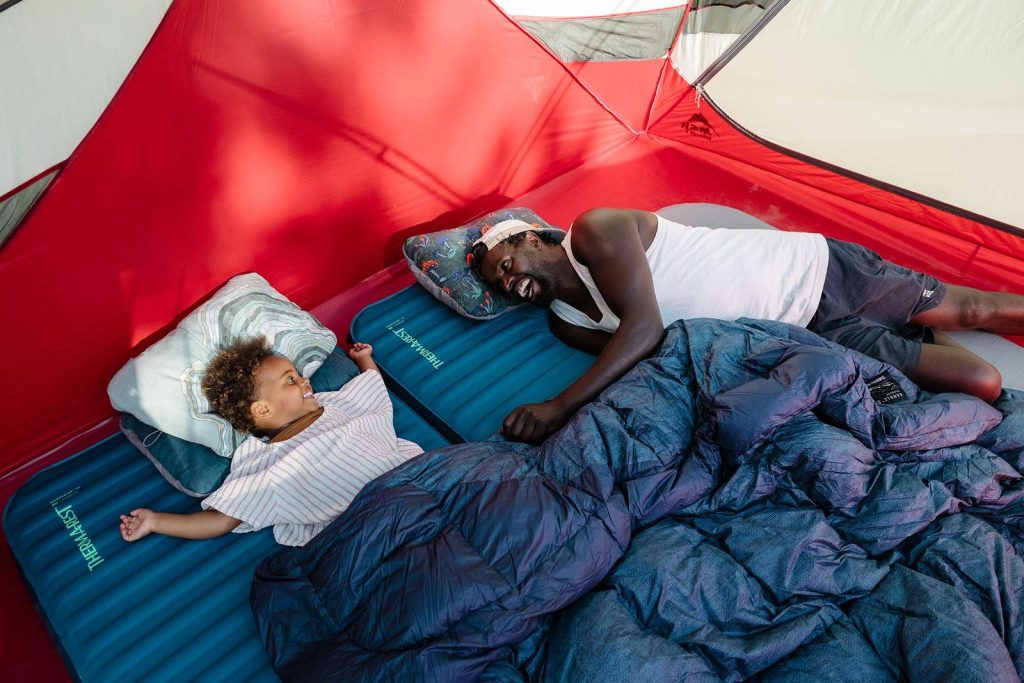 Two campers sleeping on Therm-a-Rest MondoKing 3D mattresses in a tent