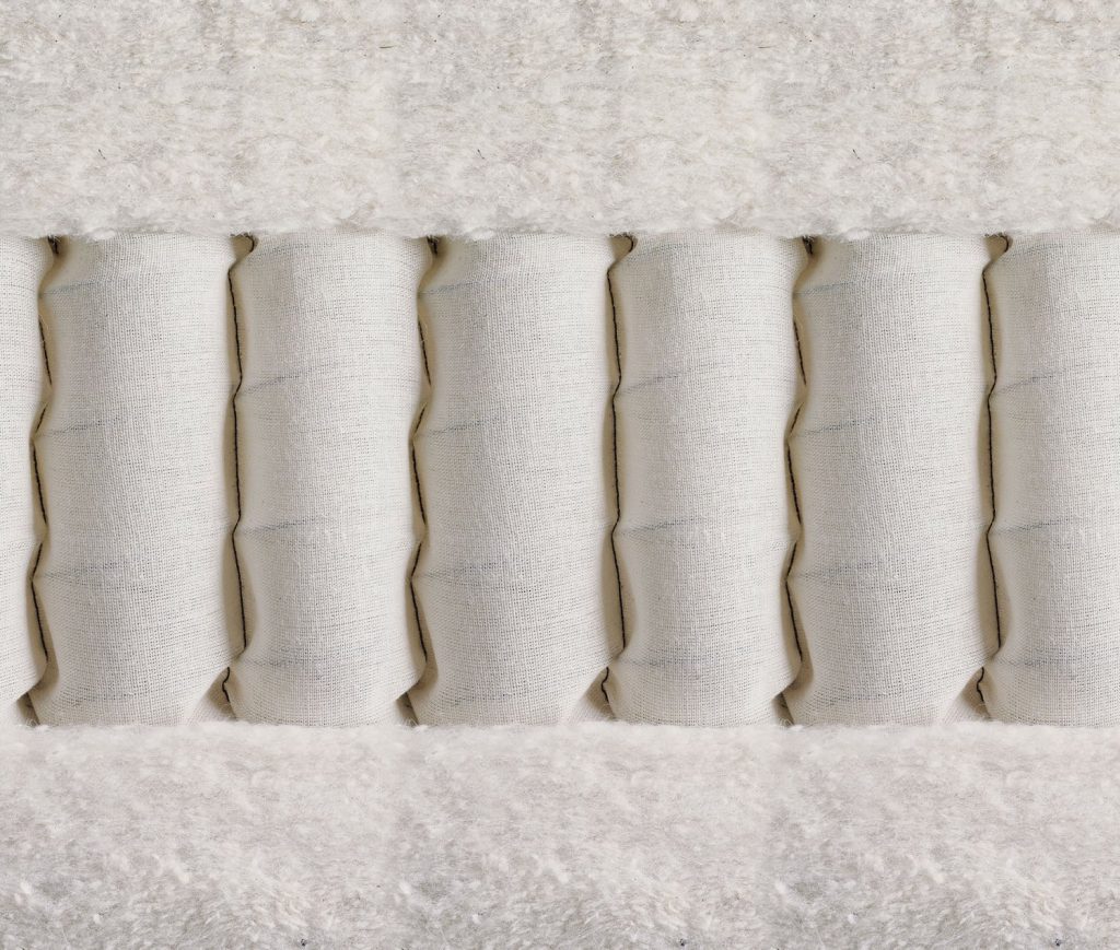 Vispring Elite mattress cross-section with pocket springs between wool and cotton layers