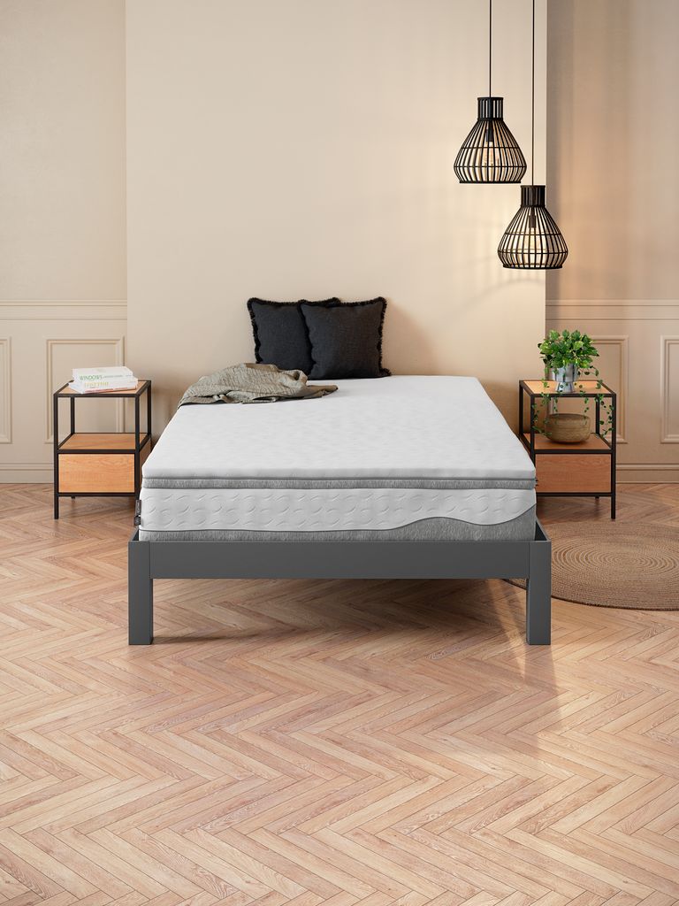 WELLPUR BOKSELVI topper on a bed in a bedroom