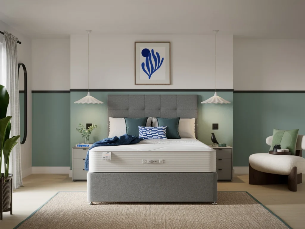 Slumberland Air 3.0 Memory mattress on a grey divan in a bedroom with green walls