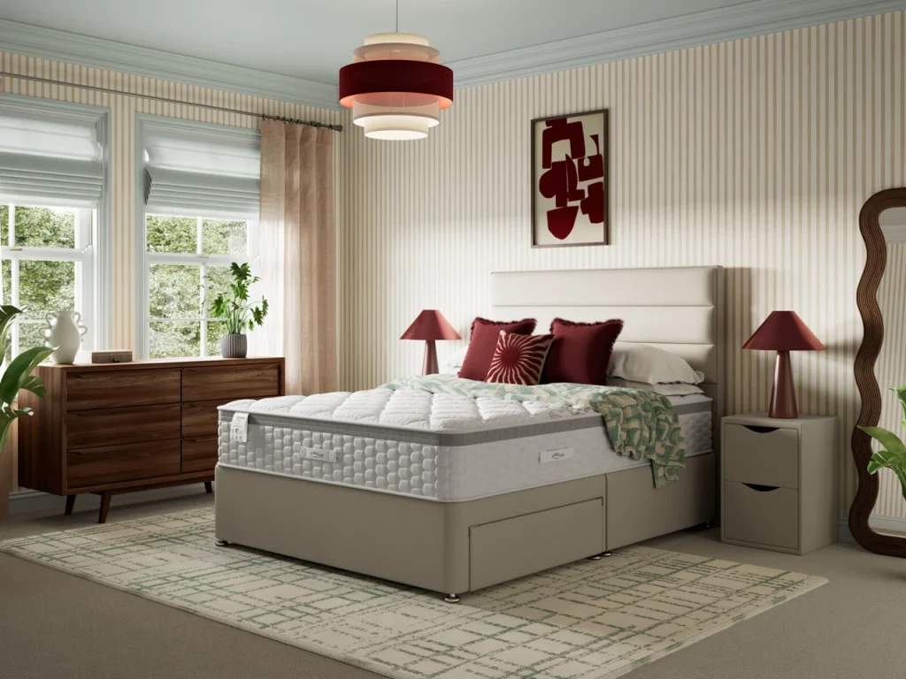 Slumberland Response Latex 1.0 on a beige divan in a striped bedroom