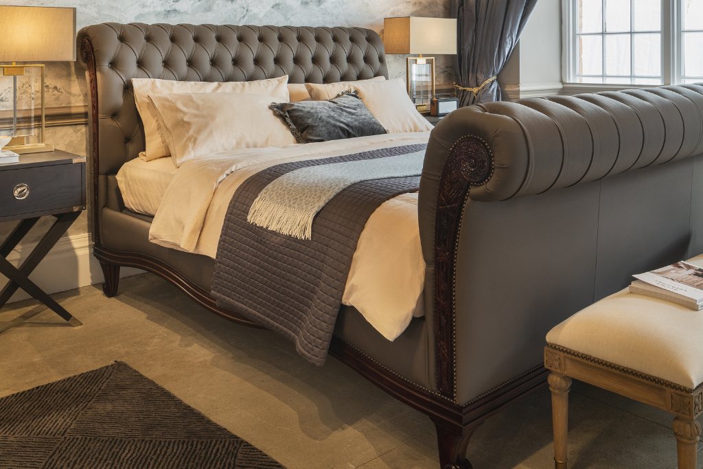 And So To Bed Bonaparte Deep Buttoned Bed seen from the foot end with a bench