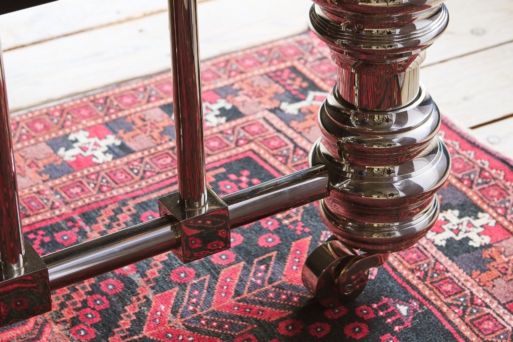 And So To Bed Dickens Bed close-up of the turned nickel leg post on a rug